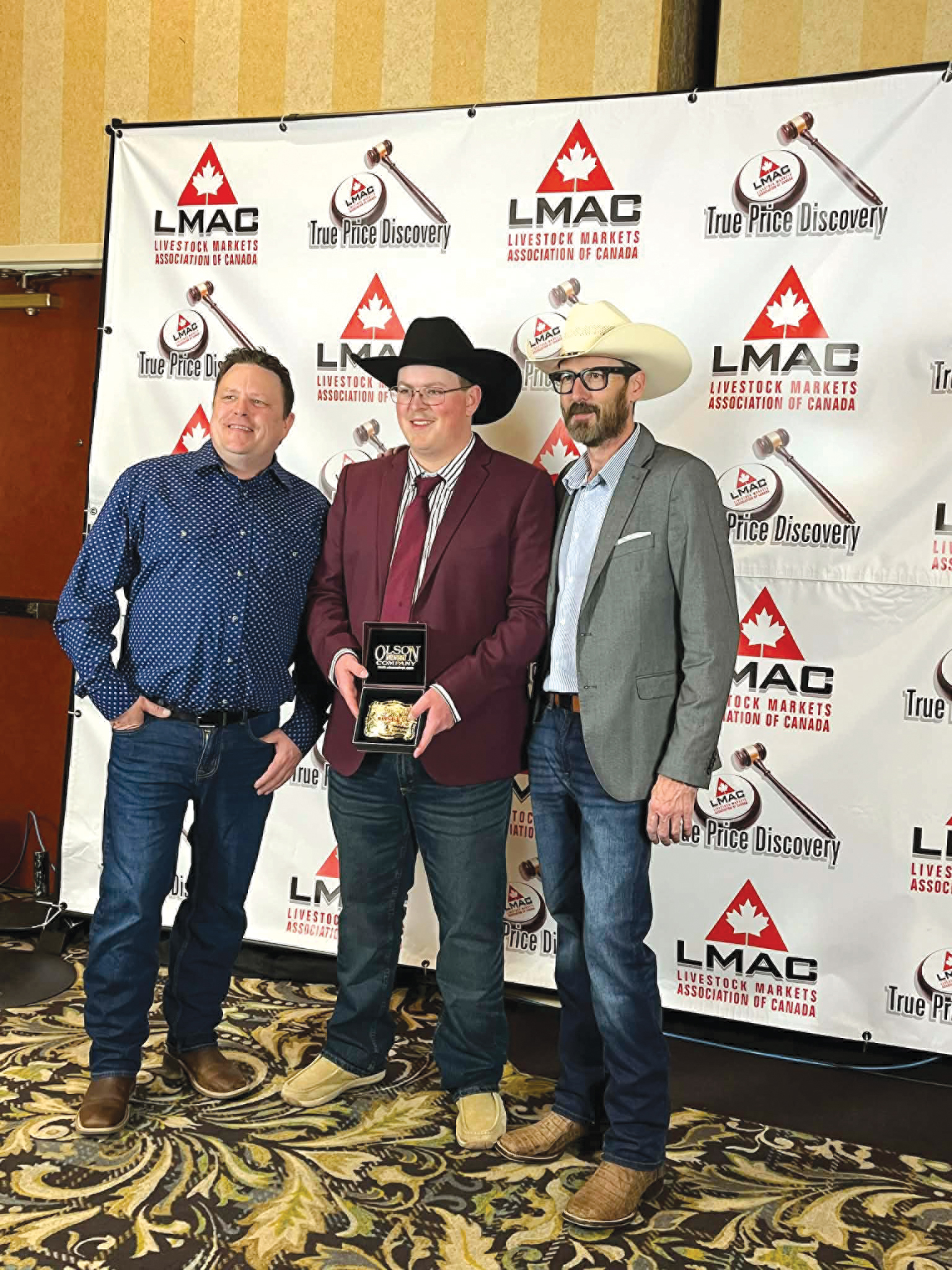 Chad Kelly, Ty Cutler, and Rhett Parks of Whitewood Livestock at the awards ceremony.<br />
